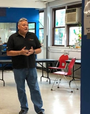 CPR instructor explaining life-saving techniques during a training class